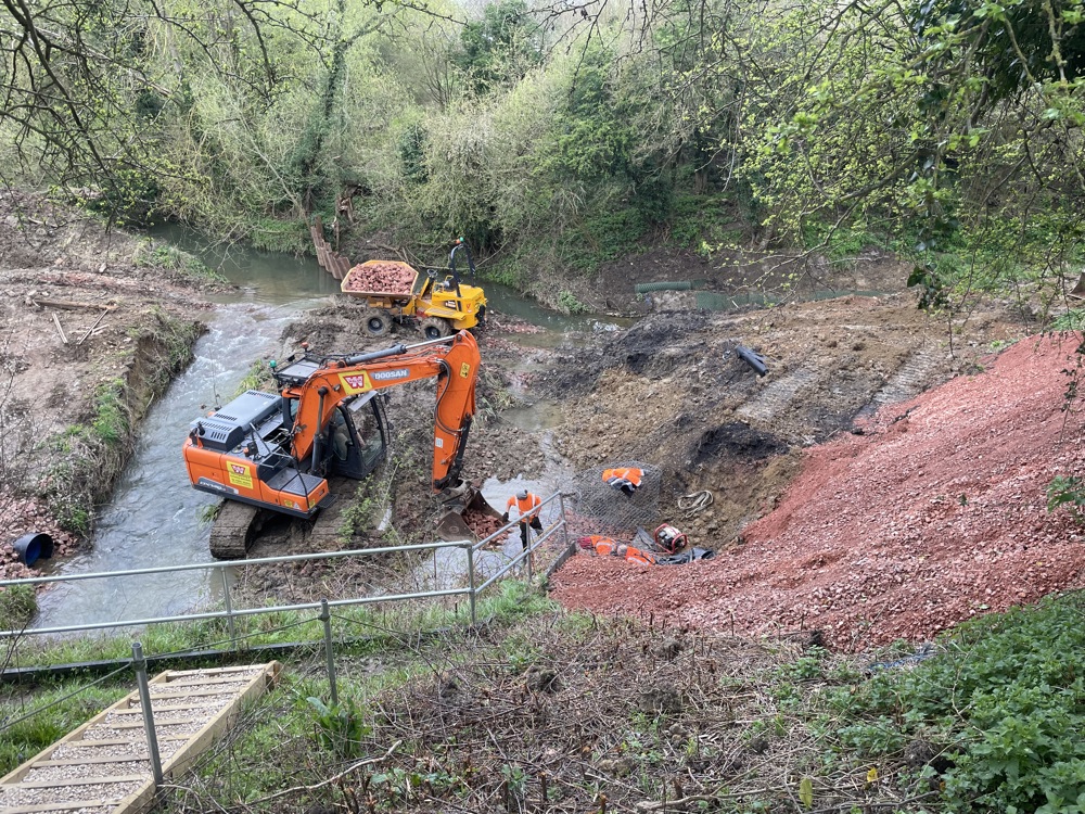 Clearing gravel deposits from the River Isbourne bed copy.jpg